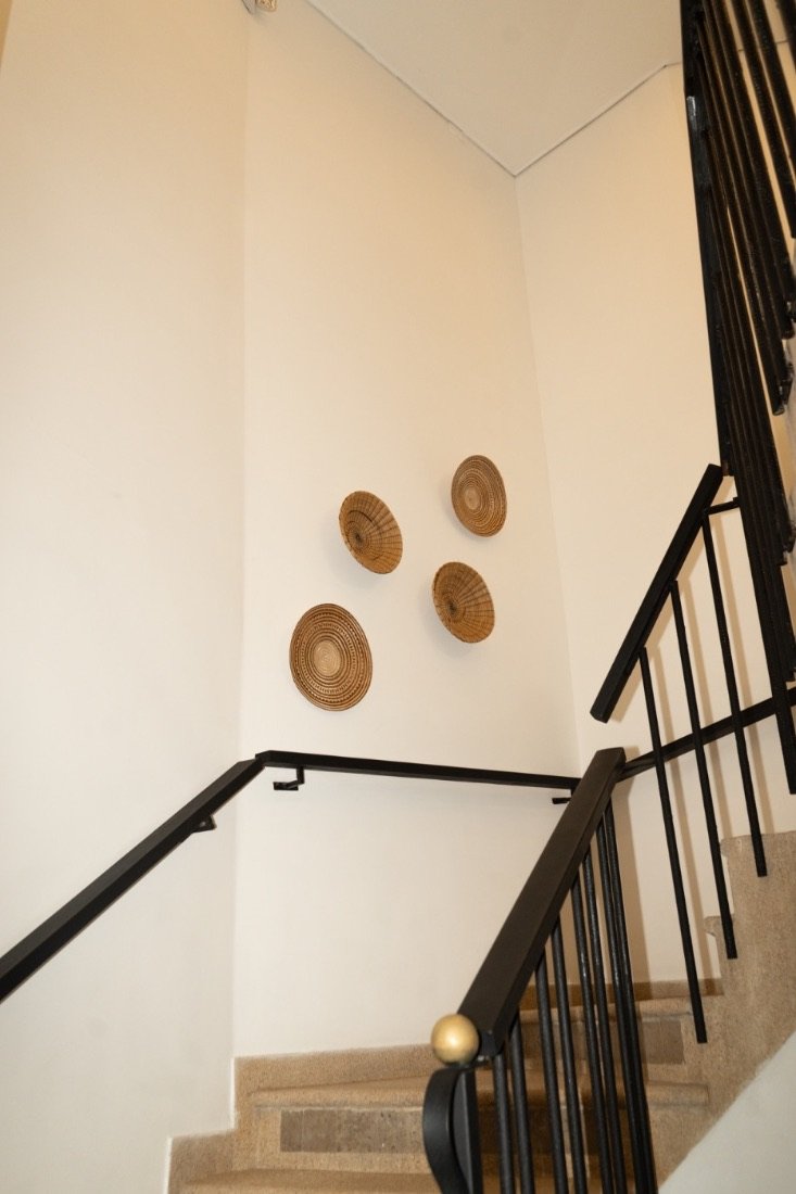 Stairwell architectural detail with woven baskets